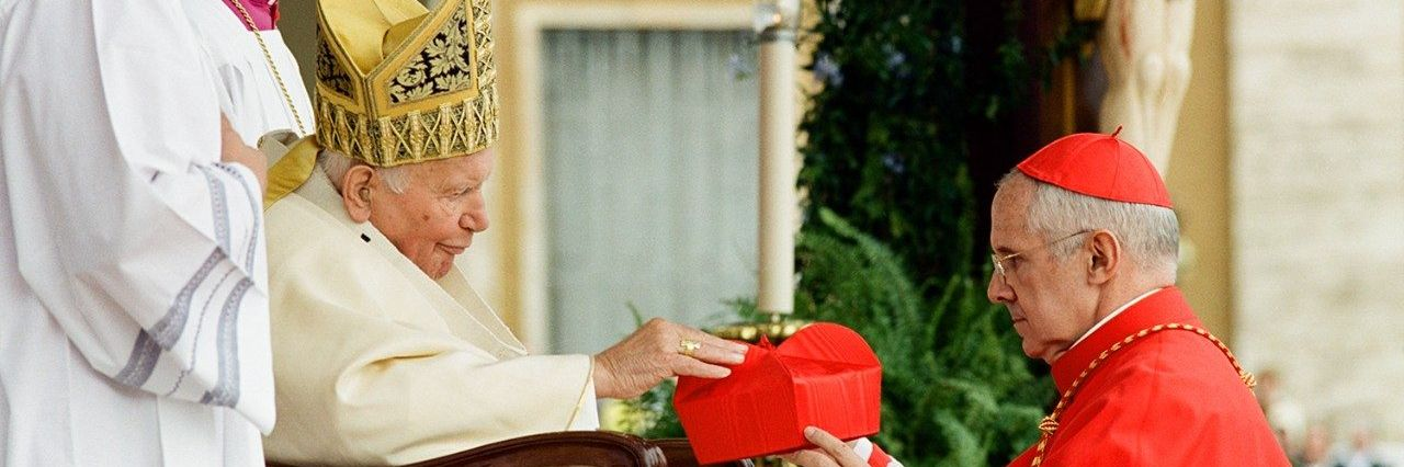 Cardinal Tauran receiving the cardinal's biretta from John Paul II, October 21, 2003.